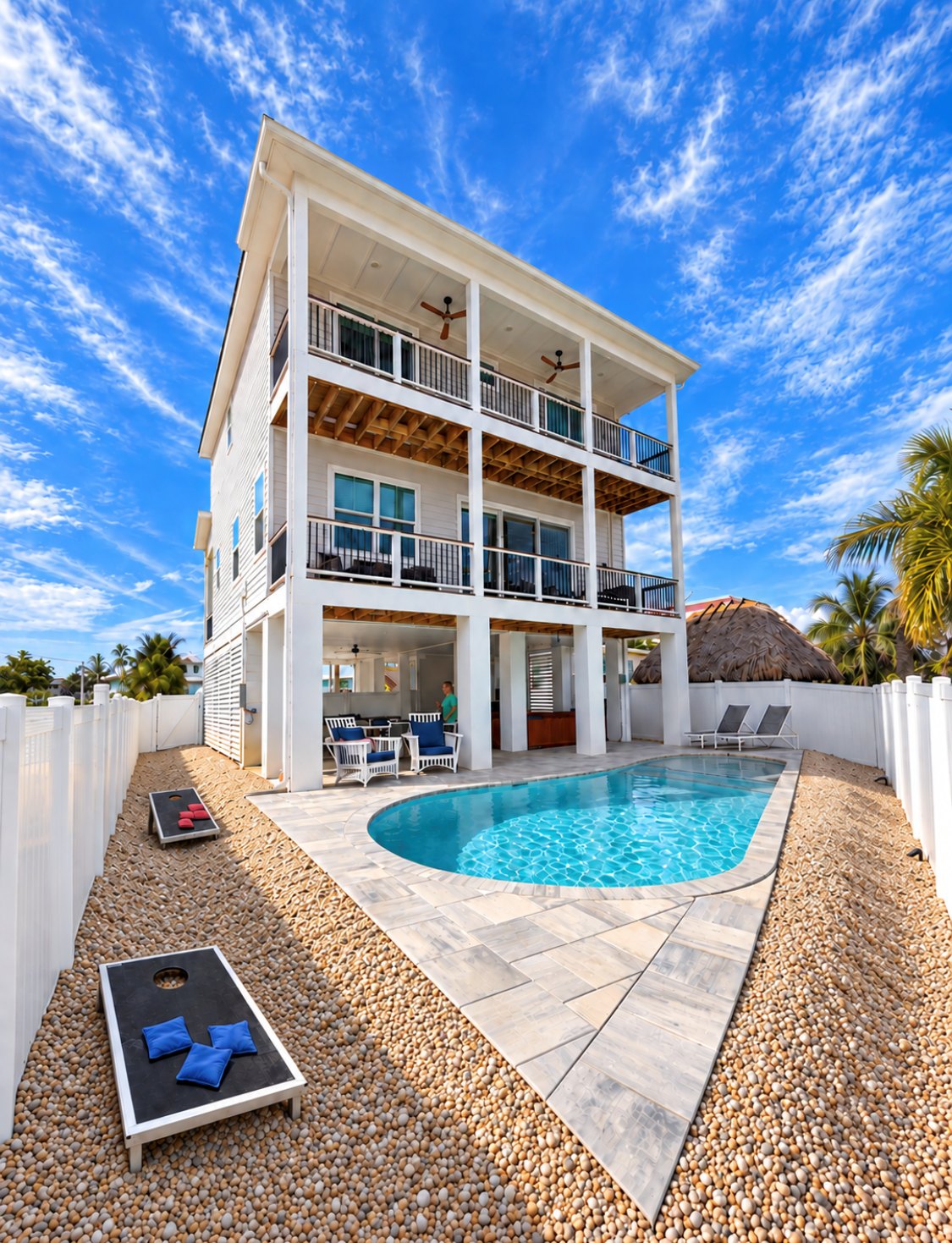 Private pool and backyard behind the raised three-story Do We Beach House