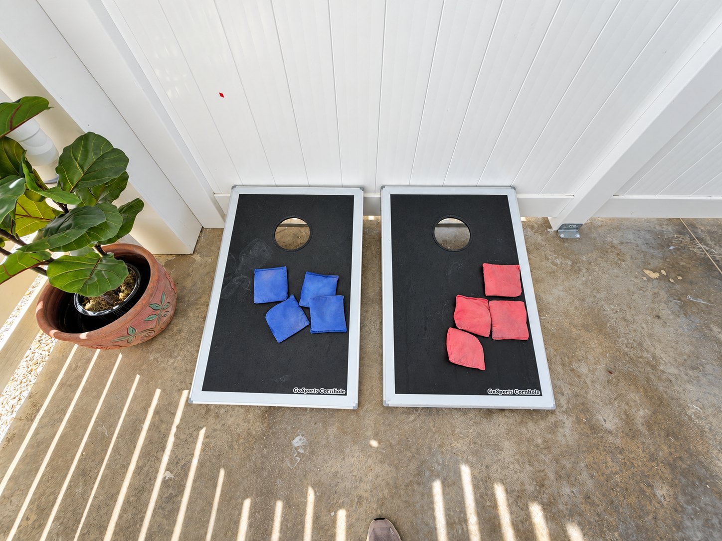 Cornhole boards on the covered patio